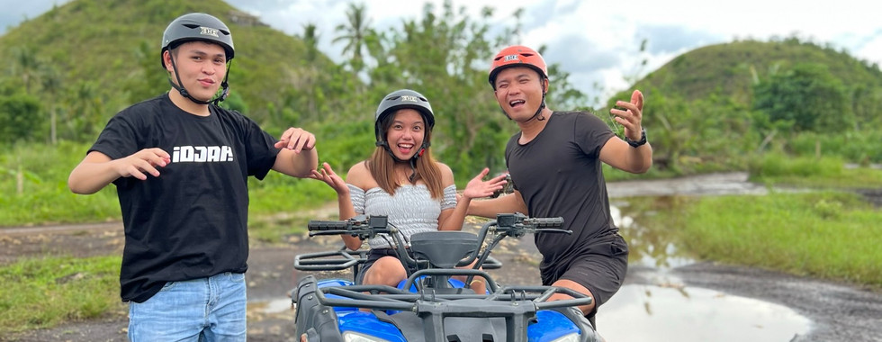 three persons on atv ride