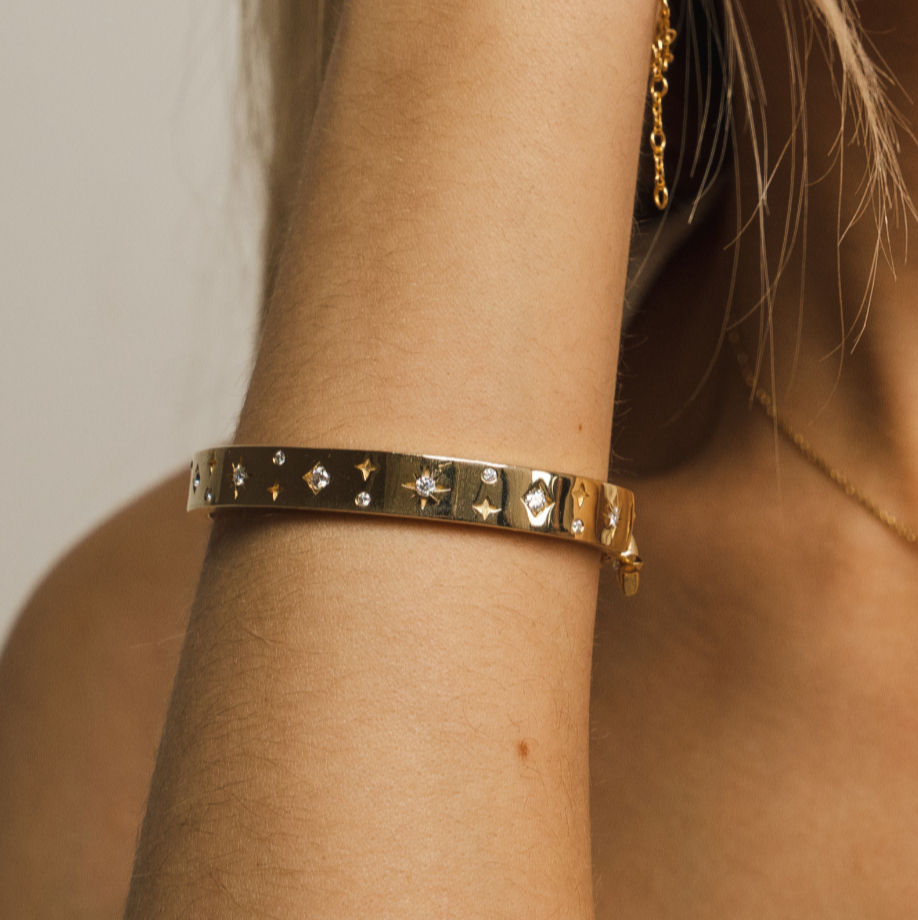 A premium gold vermeil bangle set with 4- and 8-pointed stars