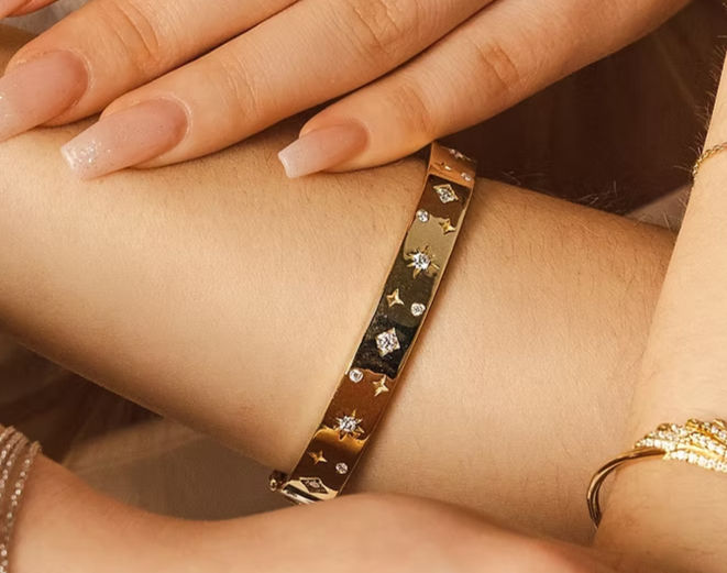A girl wearing Bloomtine's Illuminess™ Starset Bangle