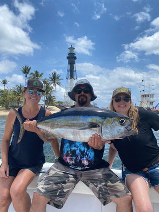 Just Right Florida Charters customers with a huge blackfin tuna at light house point florida 