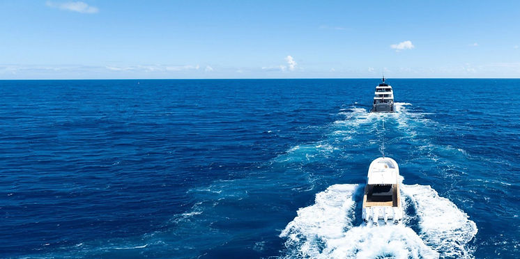 Large yacht towing large center console fishing boat