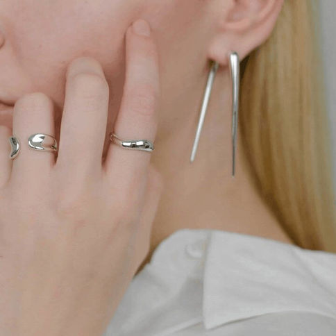Ethos asymmetrical sterling silver ring worn on female hand minimal handmade jewelry