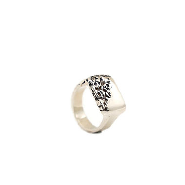 The Mutation ring in polished silver with oxidized finish, a bold statement jewelry piece for everyday wear.