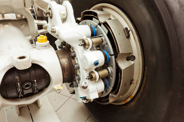 Close-up of an aircraft landing gear wheel and brake assembly