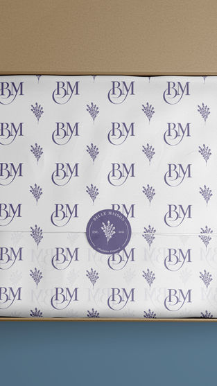 A Belle Maison-branded tissue paper design inside an open shipping box. The repeating pattern features a monogram logo and botanical illustrations, complemented by a branded sticker for a polished presentation.
McKenleigh Spitler | Packaging Design