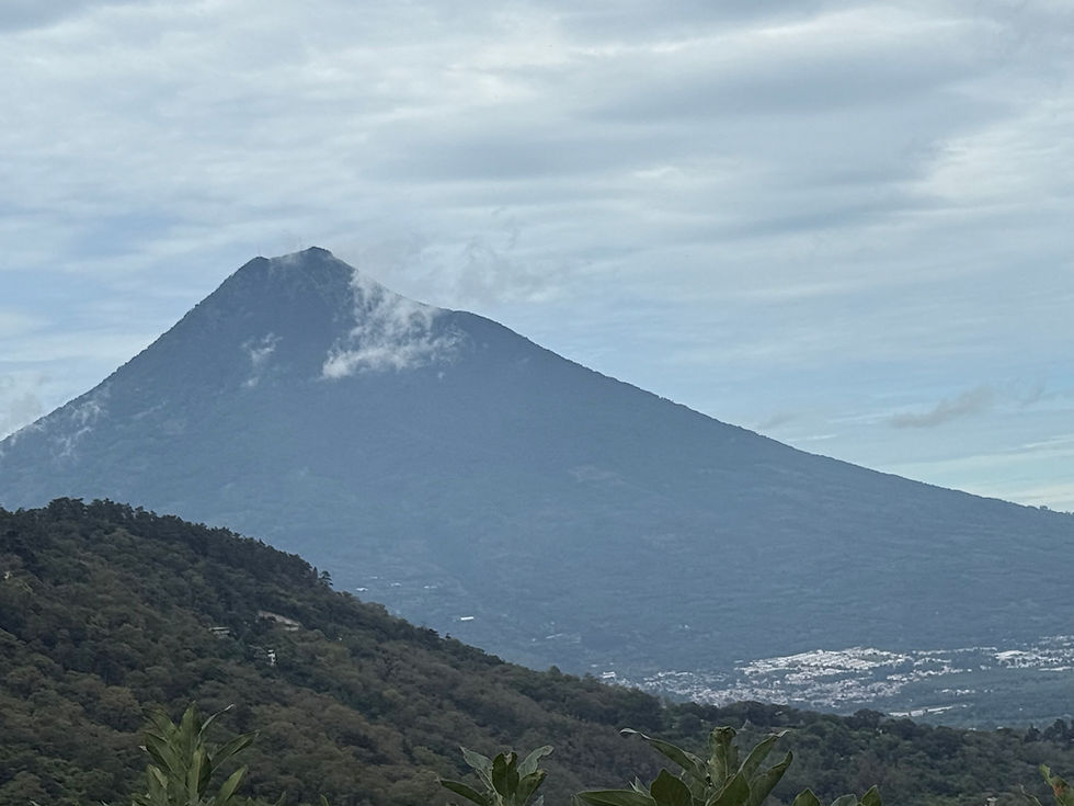 Volcano with a light wisp of cloud near the peak in Guatemala