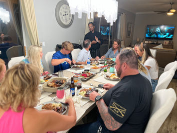 Group of friends enjoying a formal dinner party together