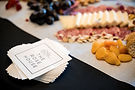 The Rose House napkins next to a catering platter