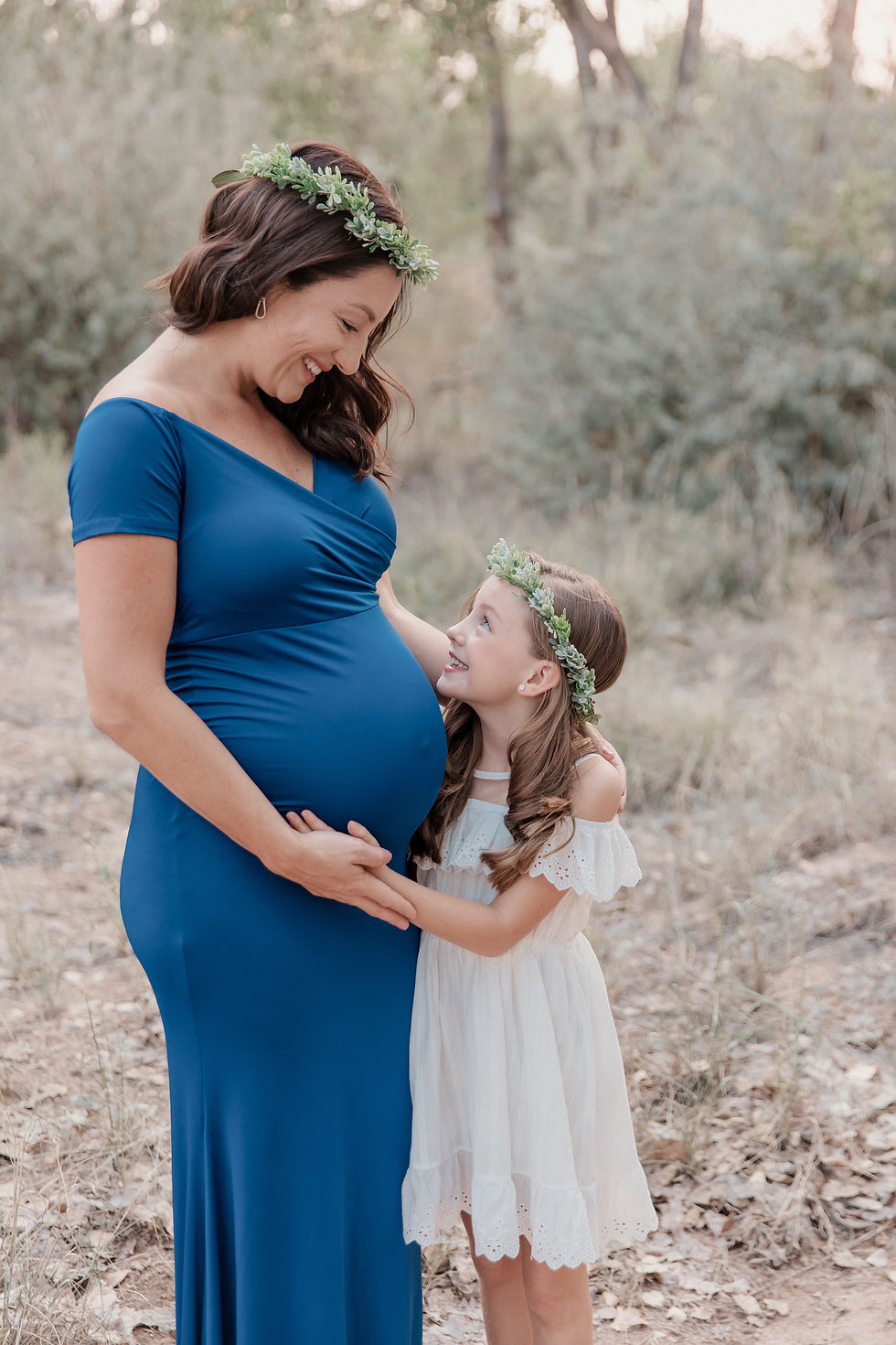 pregnant mom and little girl with hair wreaths
