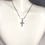 Thumbnail: View of 005 large plain cross pendant on sterling silver snake chain necklace