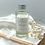 Thumbnail: Nordic Cedar Reed Diffuser Refill, 100ml clear glass bottle with silver cap and 6 natural fibre reeds.