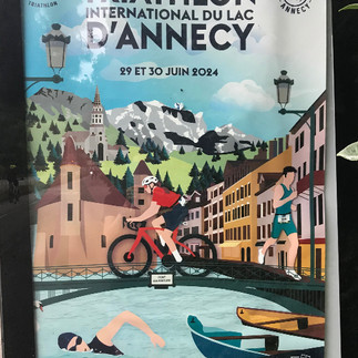 A billboard advertising the forthcoming triathlon in Annecy.