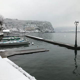 Menthon harbour in snow, Palais hotel is in the distance.