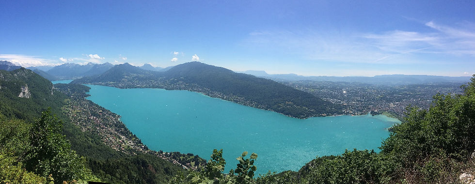 A panorama of lake Annecy from the summit of Mont Baron. Annecy town is far right, part of the eastern shore is bottom left (Veyrier & Menthon). Mont Semnoz is directly opposite.