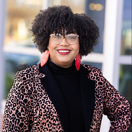 Myeisha D Hutchinson Headshot- standing.png