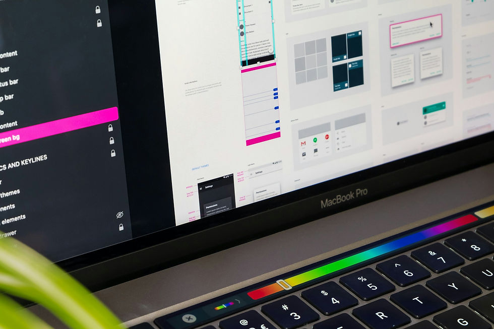 MacBook Pro displaying computer icons representing the component library and digital infrastructure of a mature design system