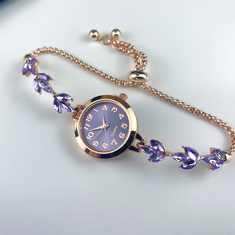 Luxury women's watch with rhinestone bracelet.