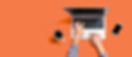 Orange desktop with a laptop