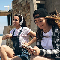 Young Women Listening to Music