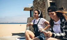 Young Women Listening to Music