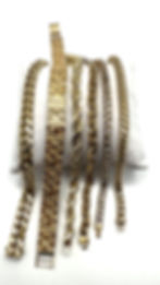 Gold bracelets and chains from a joyería en Phoenix.