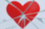 A heart painted on pieces of broken glass