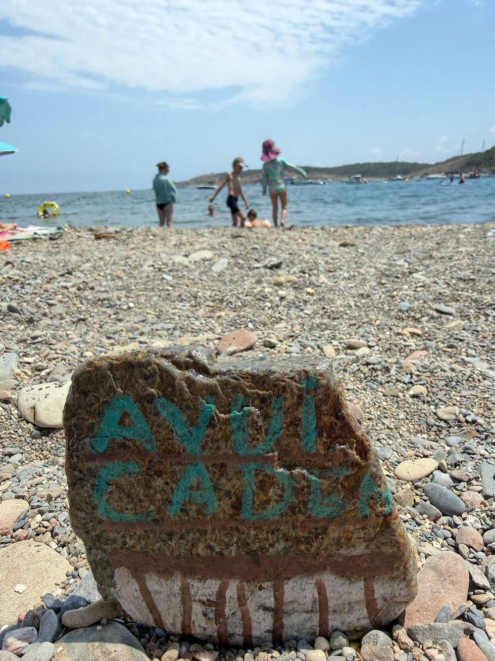 We spent today finding beautiful rocks and sea glass. Anders found this one in the sea. I think it says, "Avui cadem." I'm guessing is meant to be "avui quedem," or today we stay. The internet tells me it means something like "Let's meet today."