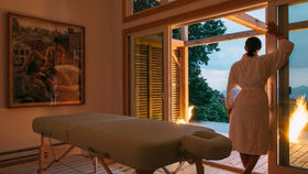 Woman in accommodation with massage table