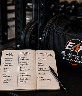 Journal with fitness wins, lessons, and challenges next to a gym bag
