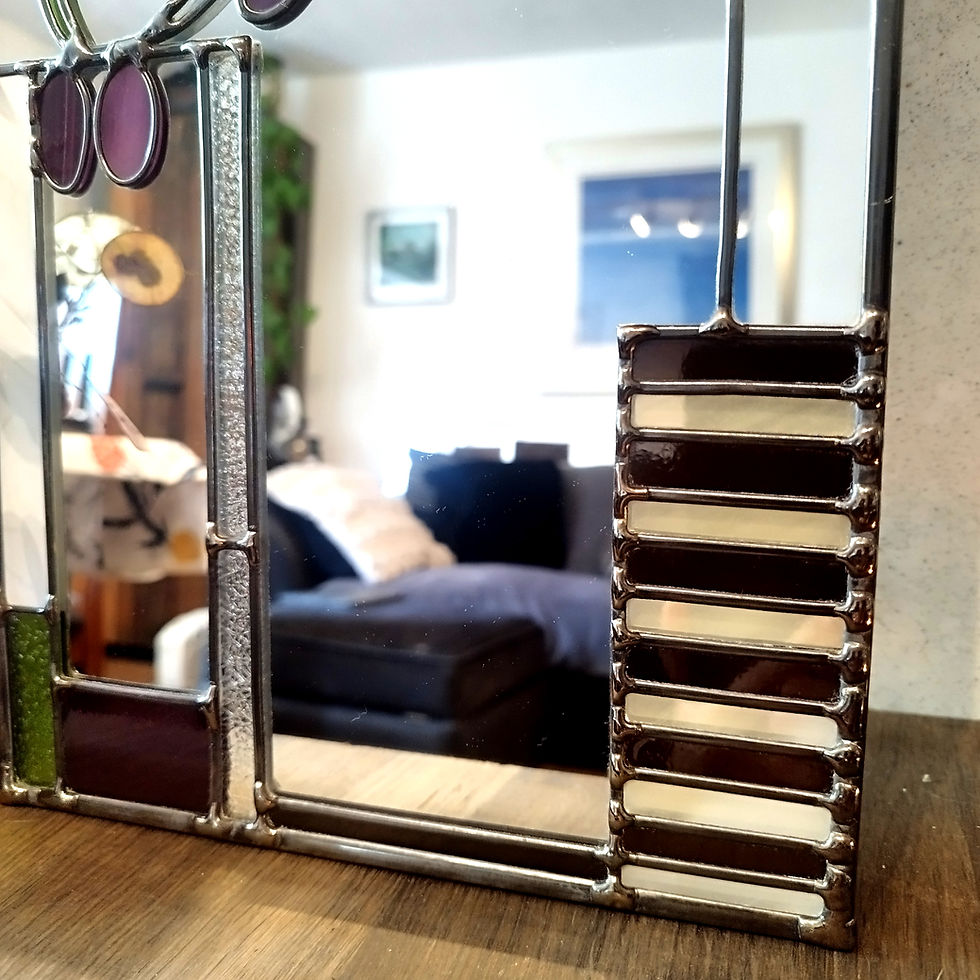 Thumbnail: Close up of handcrafted Mackintosh stained glass mirror with green rose design