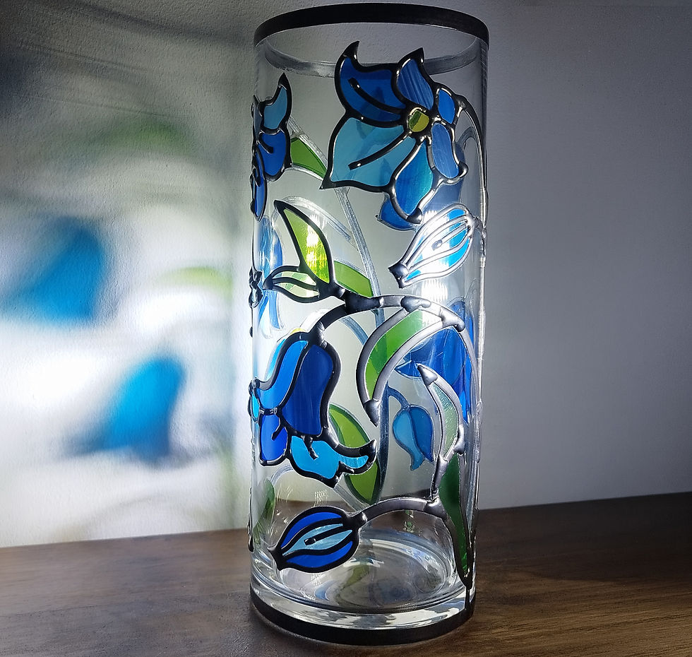 Thumbnail: Close-up of bluebell flowers in blue and green stained glass on cylindrical vase