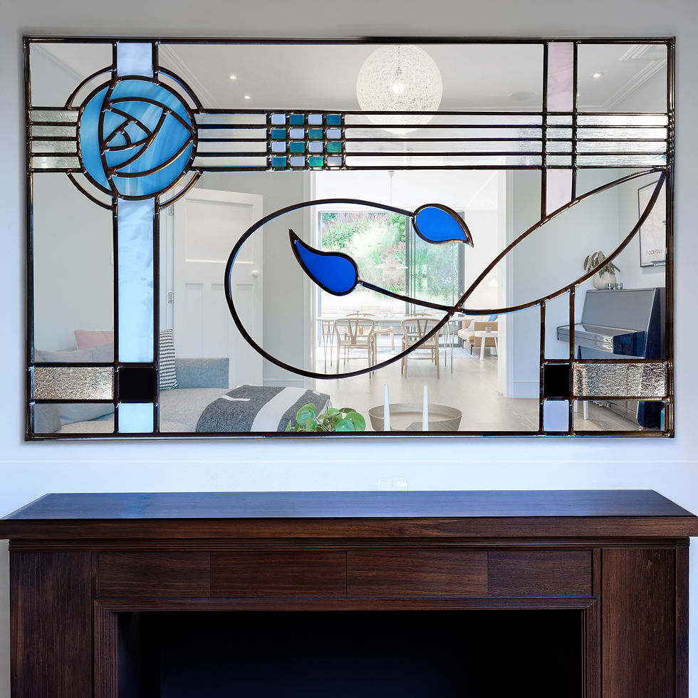 Blue Mackintosh rose stained glass mirror handcrafted in Scotland with streaky medium blue and iridescent pearl