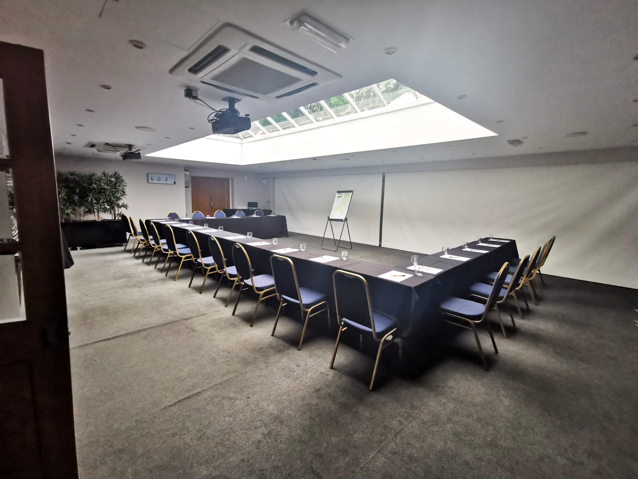 Spacious meeting room, u-shaped table setup