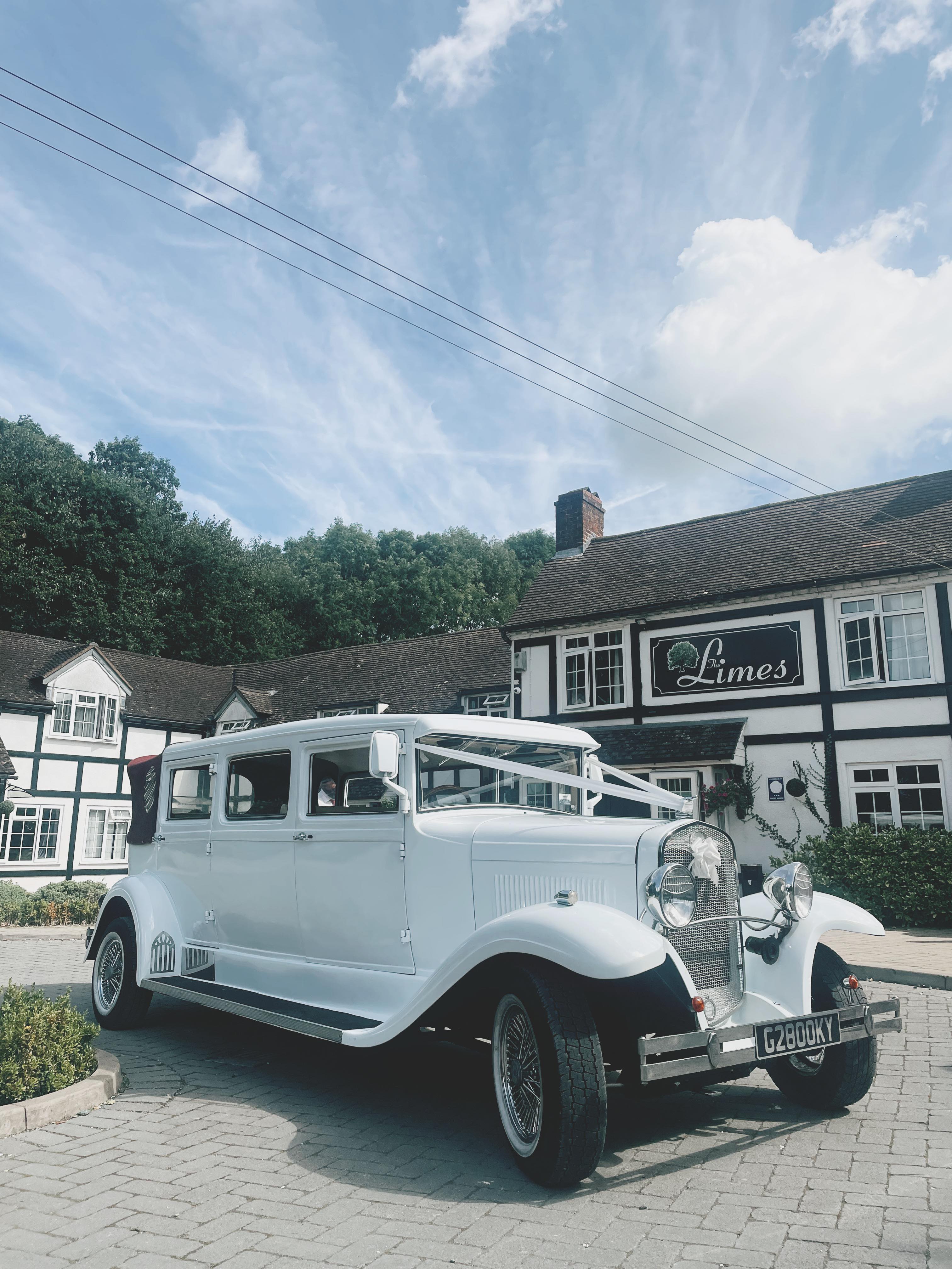 White vintage car parked at The Limes