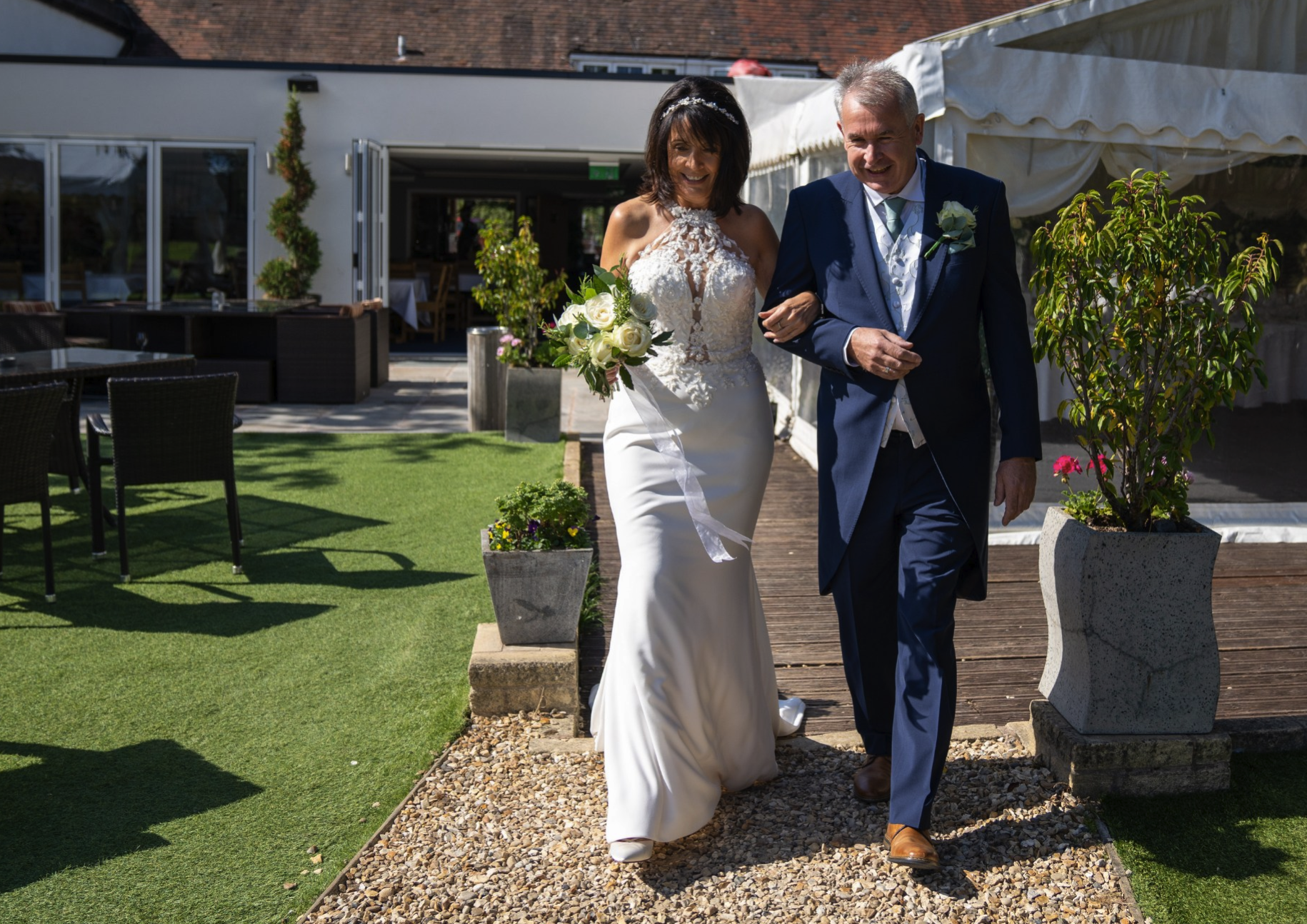 Bride and father walking down aisle