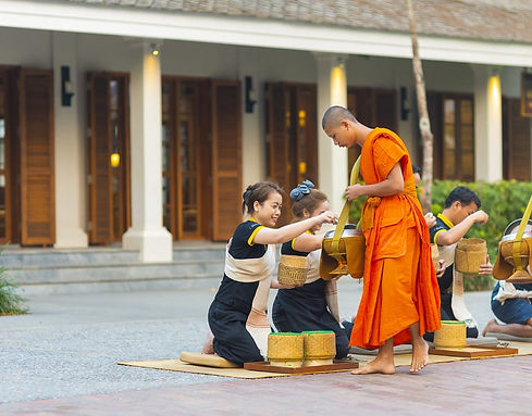avani_plus_luang_prabangmonks_receiving_alms_outside_hotel_entrance_1200x760.jpg