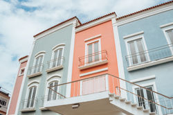 the-facades-of-the-pastel-colored-buildings-with-p-2025-02-03-05-35-04-utc