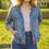Thumbnail: Model wearing the Clara Vintage Style Jean Jacket, showcasing its tailored fit and classic denim detailing, highlighting the