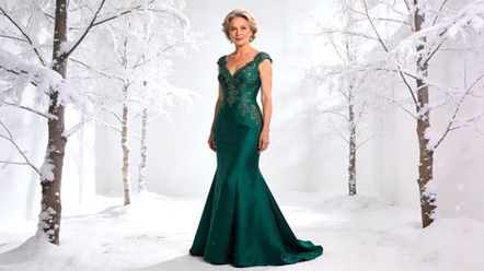 Lady models Green Mermaid Gown by Vivien Lauren
