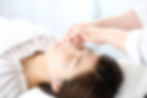 woman receiving facial acupuncture