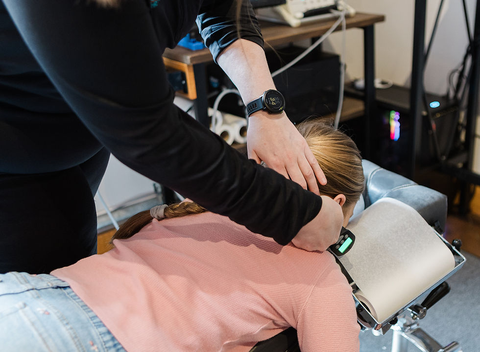 Child receiving chiropractic adjustment for posture and backpack-related spinal stress