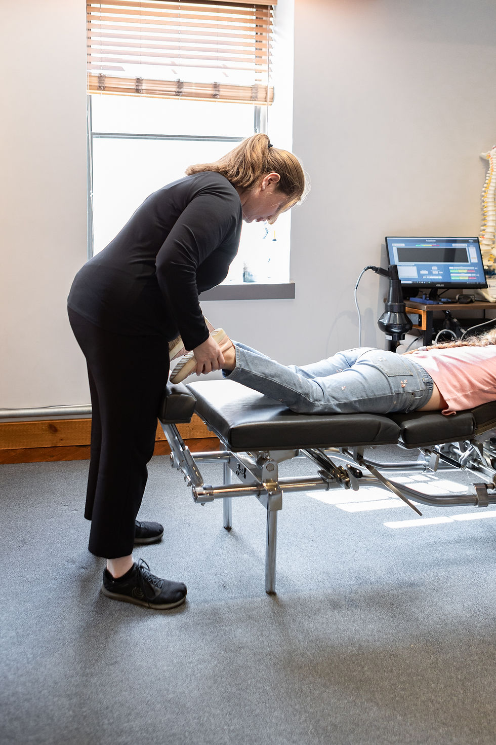 chiropractor checking leg length