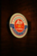 Acey DC E-Bikes Logo as a backlit sign on a brick wall. It emphasizes the high quality and extreme value that Acey DC E-Bikes provides for riders of electric bikes.