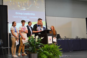 An ambassadors speaking at the podium.