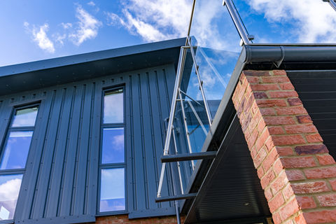 combination of angles and materials in close up section of new build house