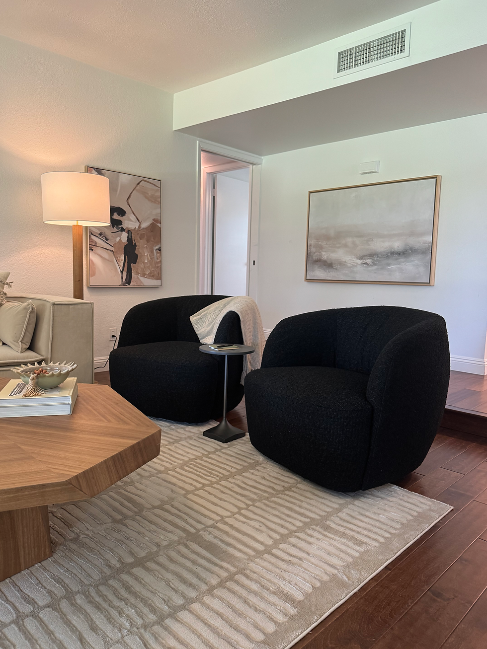 Black swivel chairs and artwork in McCormick Ranch staged house