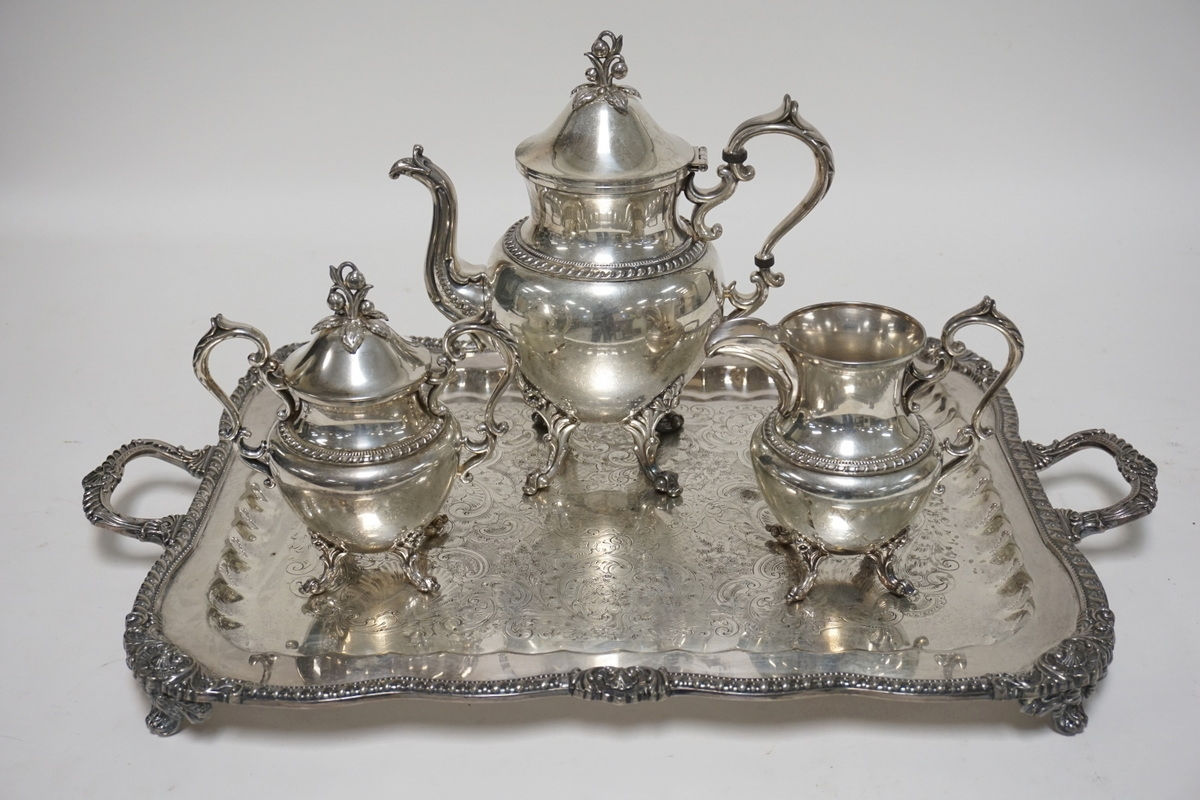 4 PIECE ENGISH SILVER PLATED TEA SET. ORNATE FINIALS AND FEET. TRAY MEASURES 25
