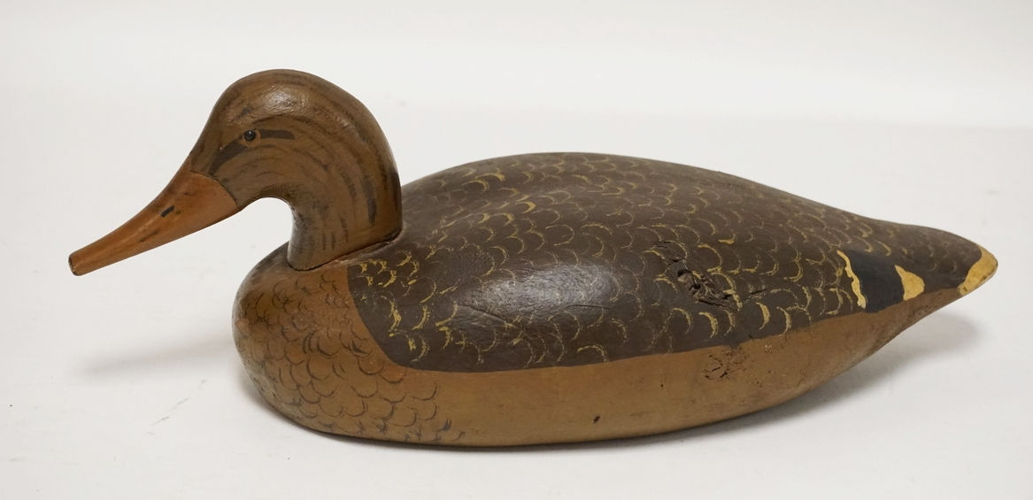 CARVED AND PAINTED WOODEN DUCK DECOY. 16 3/4 INCHES LONG.