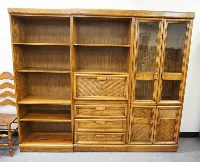 3 SECTION WALL UNIT WITH BOOKSHELVES, A DOUBLE GLASS DOOR CABINET, DRAWERS, AND