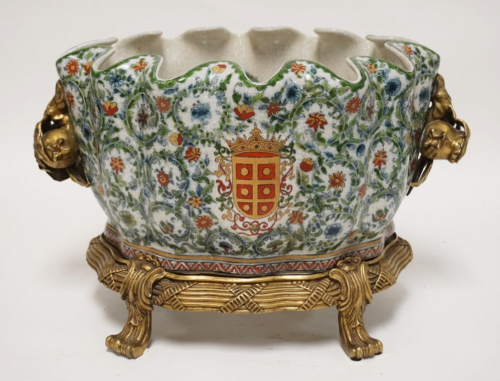 ASIAN JARDINIERE WITH A BRASS BASE. 11 1/2 INCHES HIGH. 17 3/4 INCHES LONG.